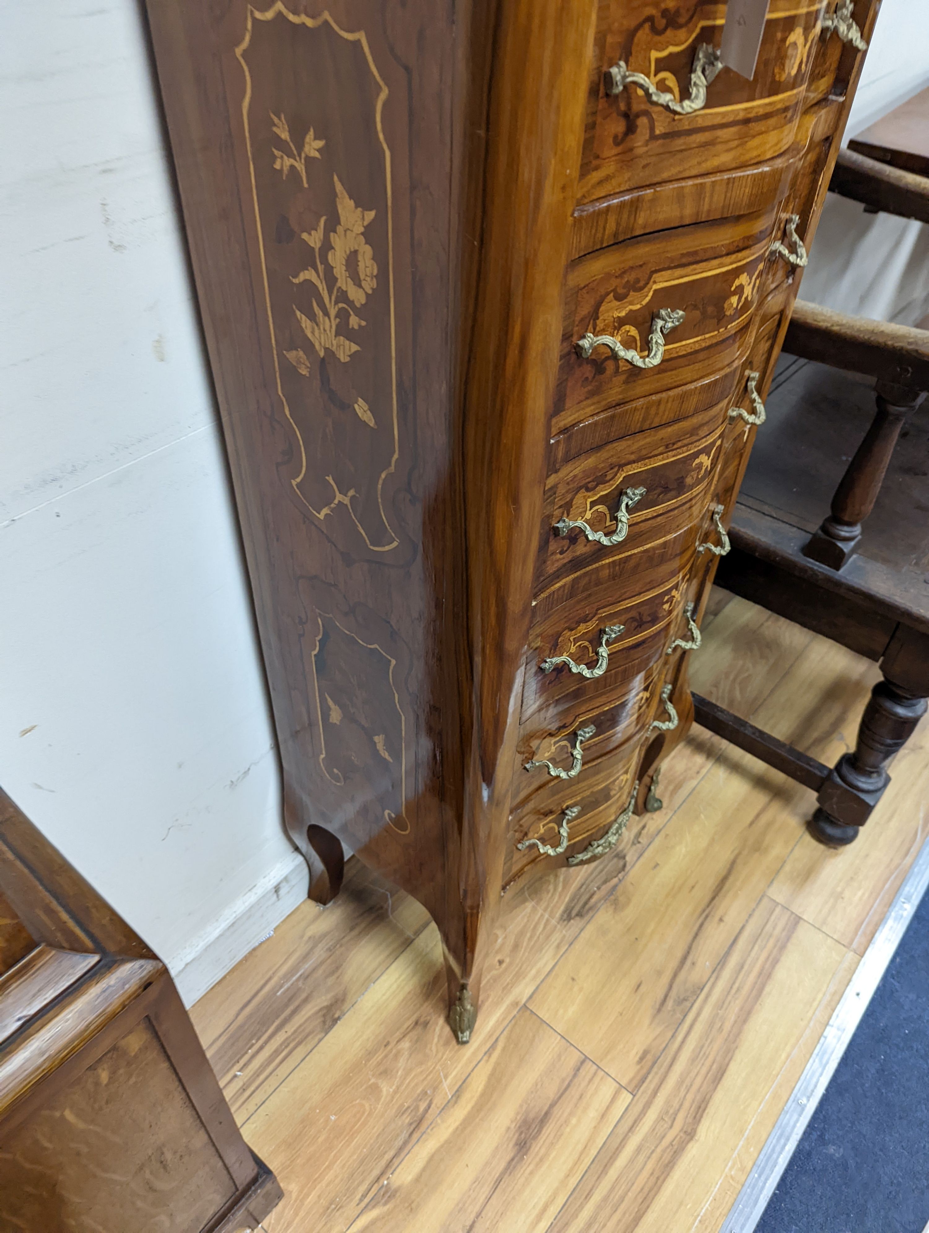 A Louis XV style marquetry inlaid serpentine fronted semanier, fitted seven small drawers, width 47cm, height 122cm